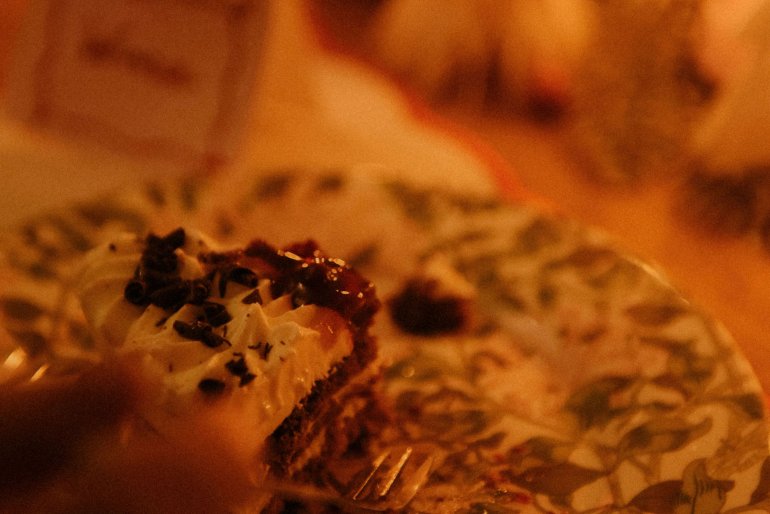 Cake with patterned plate on dining table